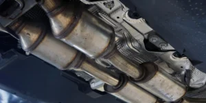 Two catalytic converters that look similar but have different values based on precious metal content and identification numbers